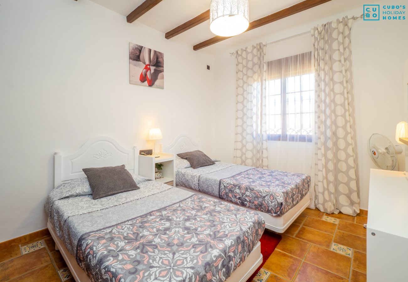 Dormitorio de esta casa rural en Alhaurín el Grande