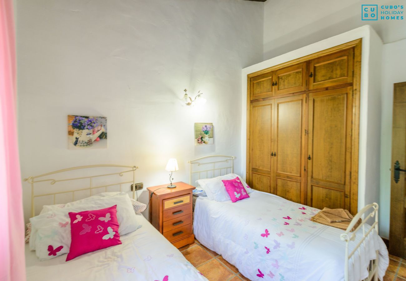 Bedroom of this house with fireplace in Alhaurín el Grande