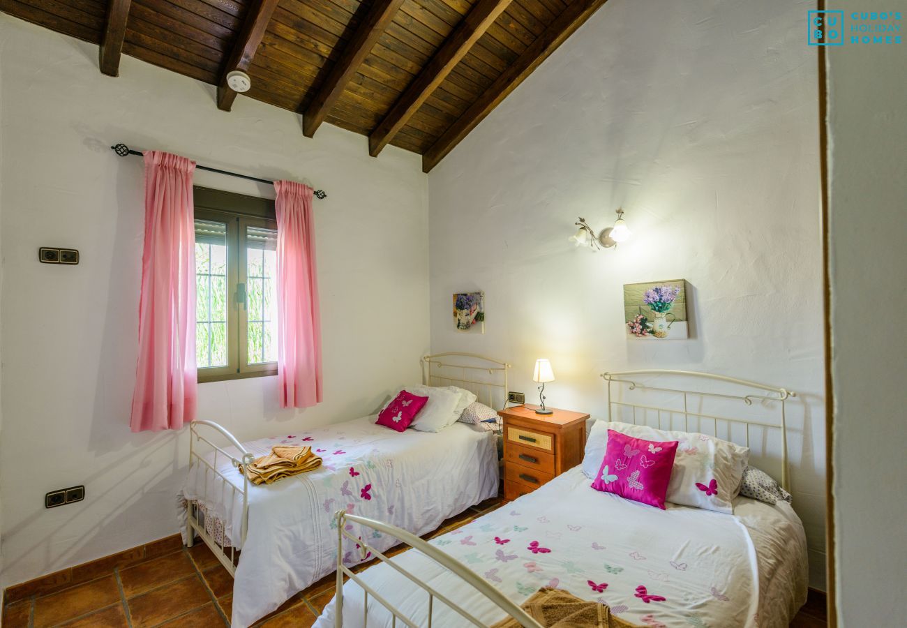 Bedroom of this house with fireplace in Alhaurín el Grande