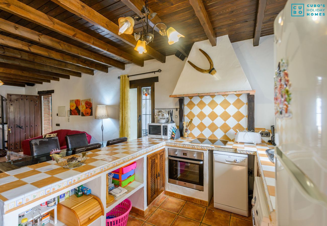 Kitchen of this house with fireplace in Alhaurín el Grande