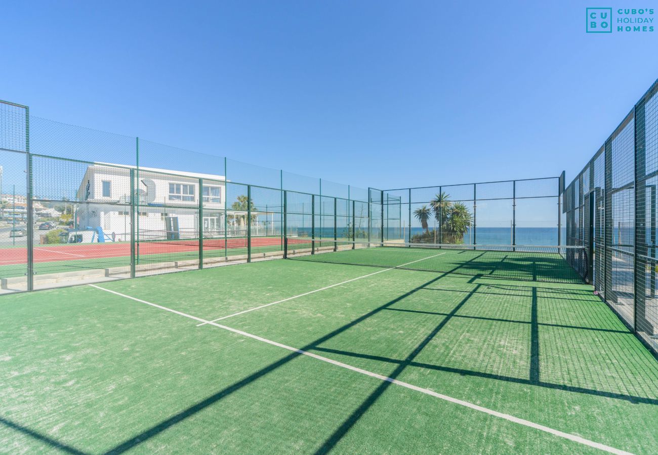 Paddle tennis courts in the common areas of this apartment in Marbella