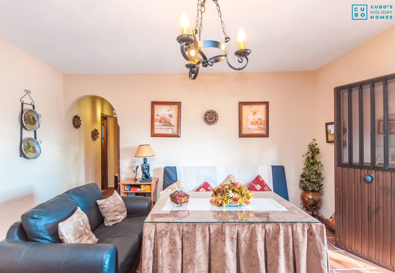 Dining room with fireplace in this country estate in Alhaurín el Grande