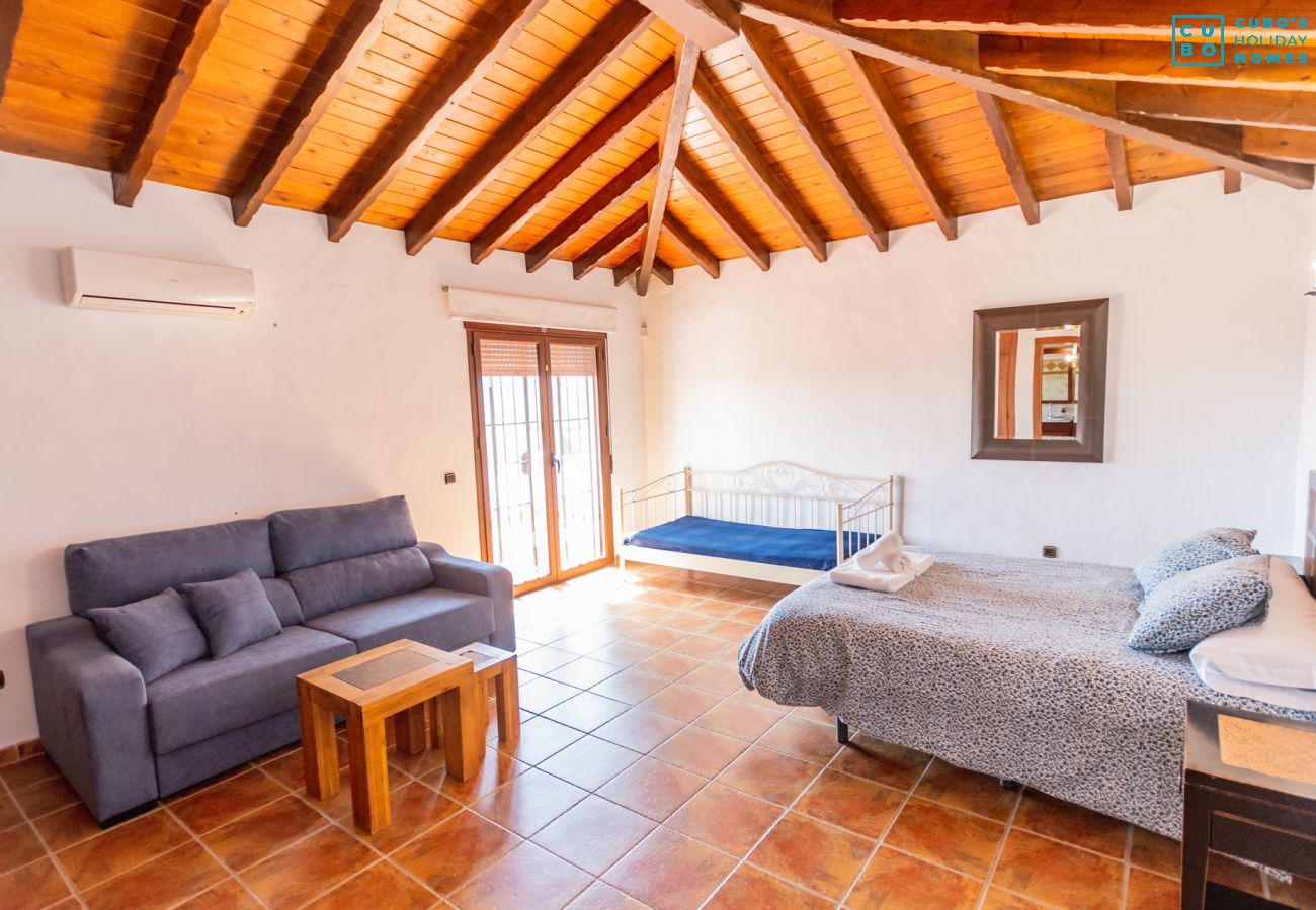 Living room with fireplace in this villa in Alhaurín el Grande