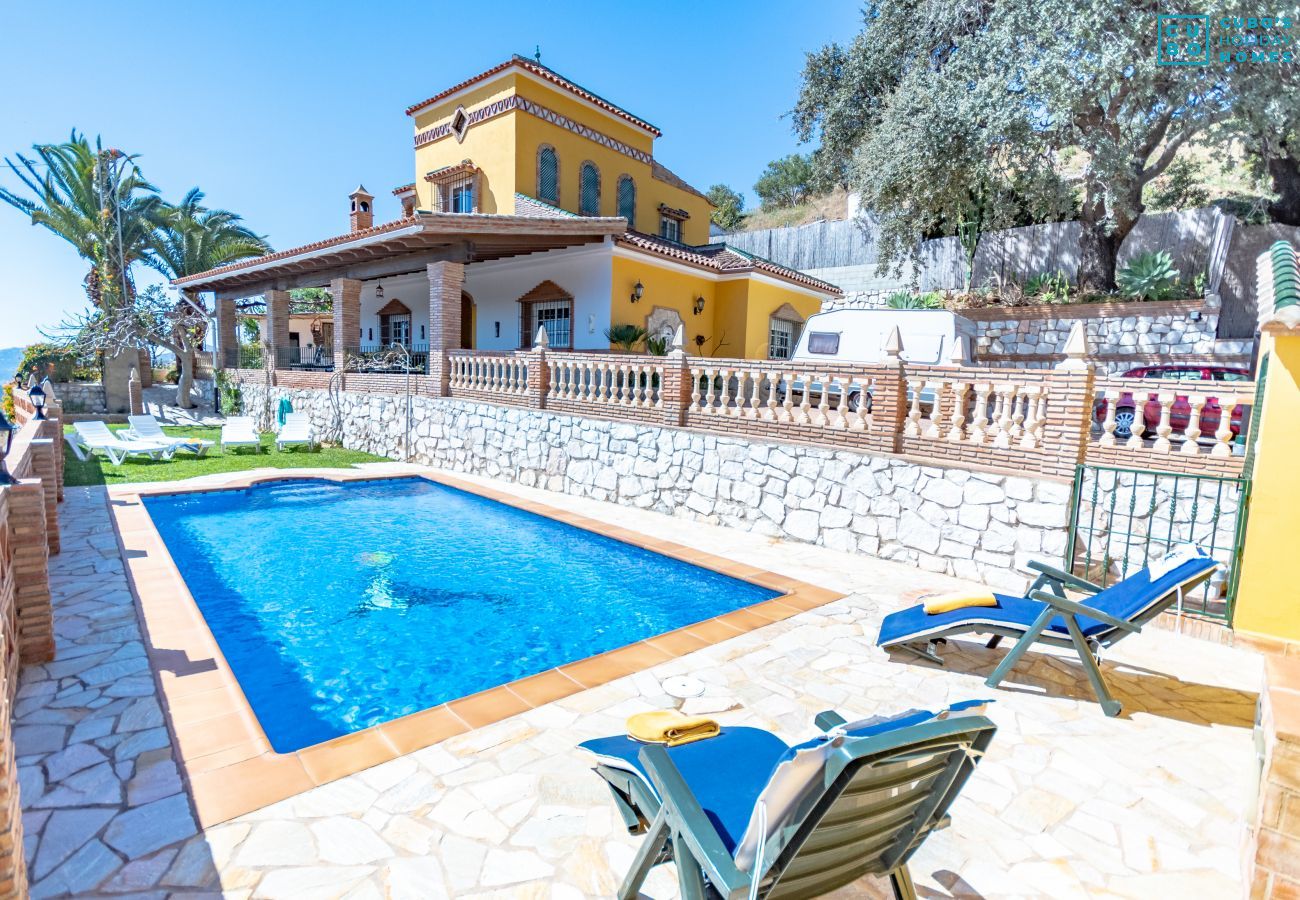 Pool and outdoor terrace of this Villa in Mijas