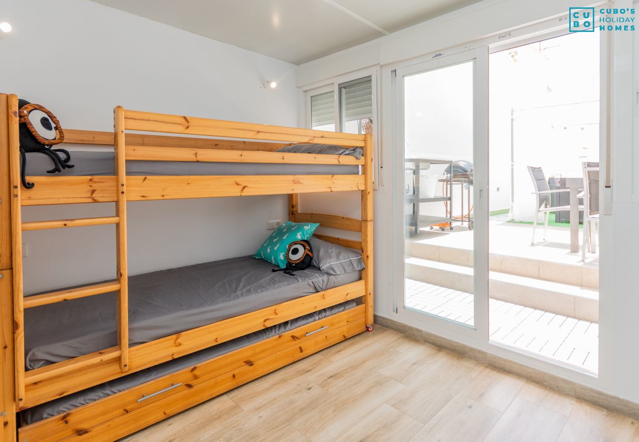 Bedroom with bunk beds in this apartment in Rincón de la Victoria