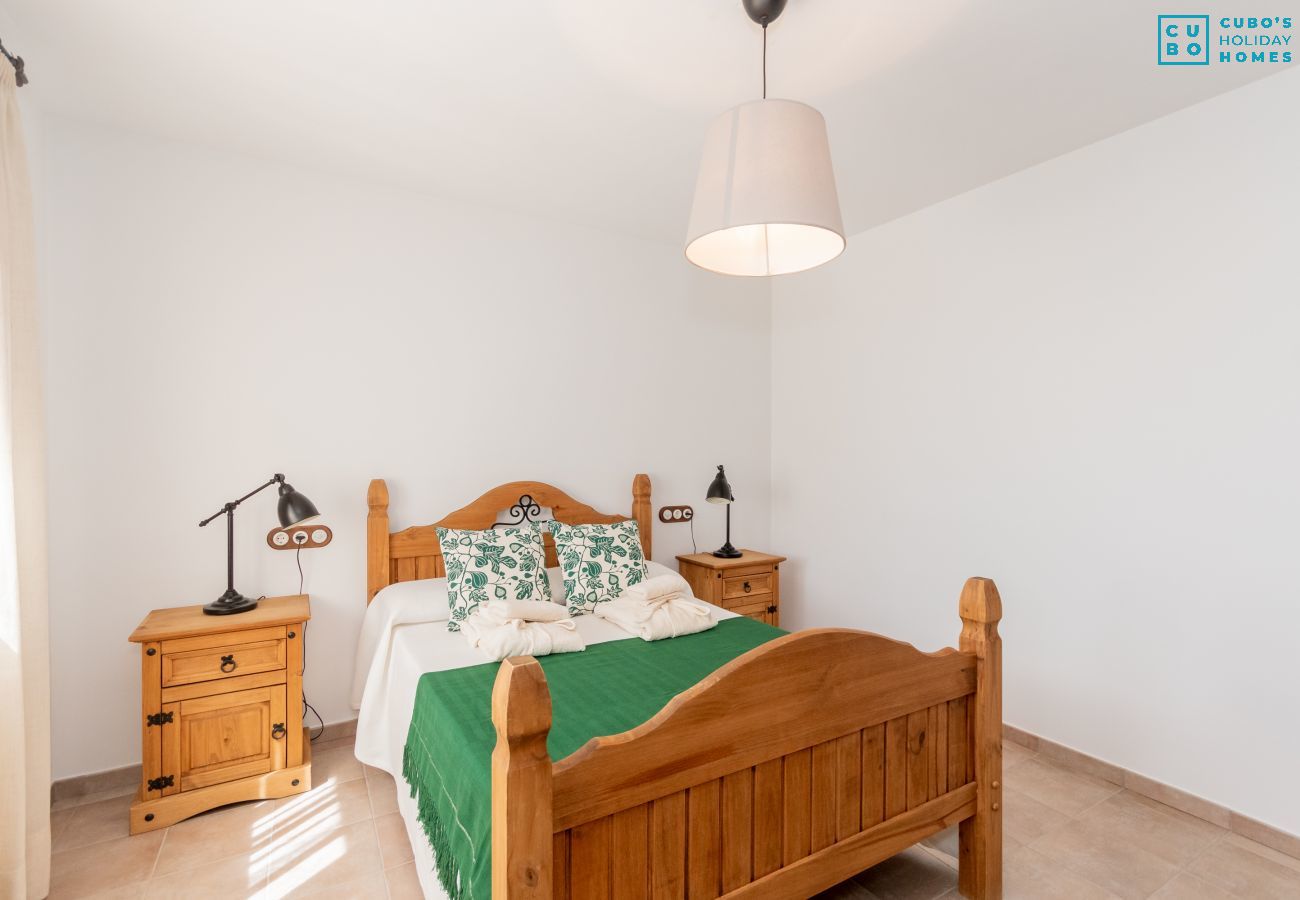 Bedroom of this house with fireplace in El Torcal