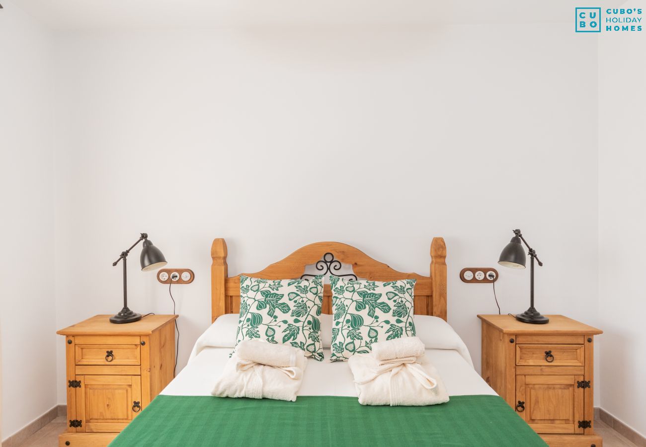 Bedroom of this house with fireplace in El Torcal