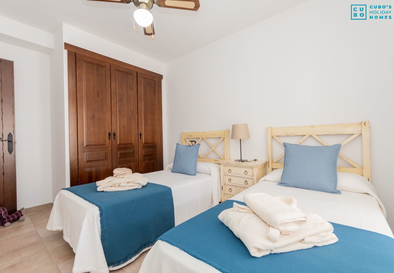 Children's bedroom of this house with fireplace in El Torcal