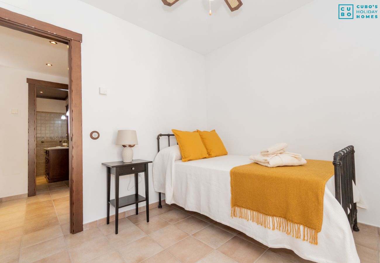 Bedroom of this house with fireplace in El Torcal