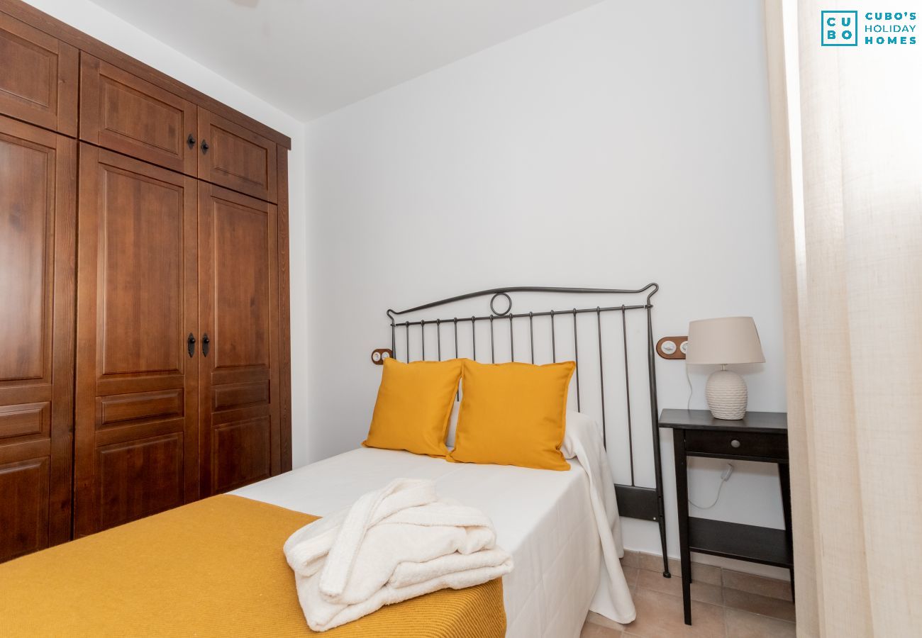 Bedroom of this house with fireplace in El Torcal