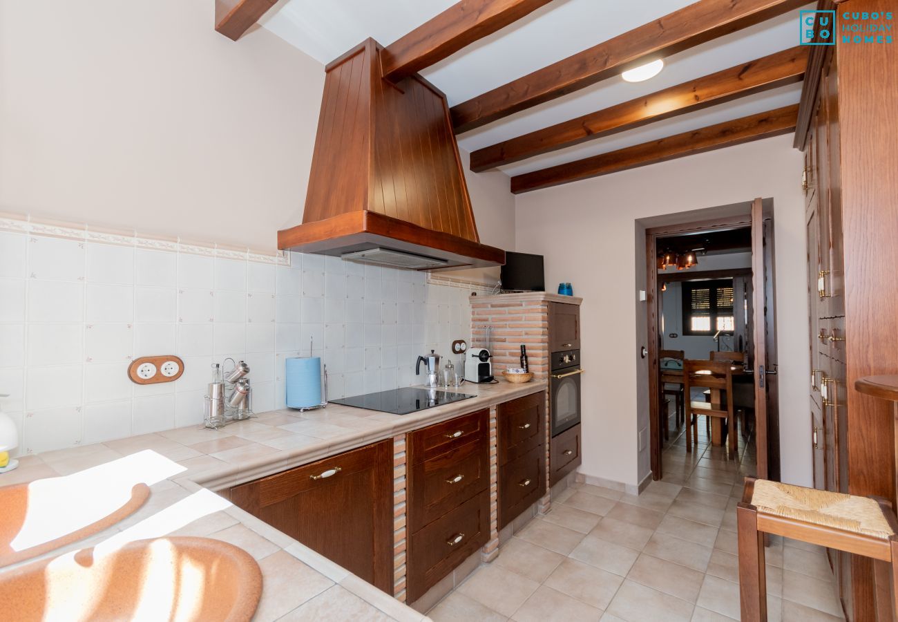 Kitchen of this house with fireplace in El Torcal