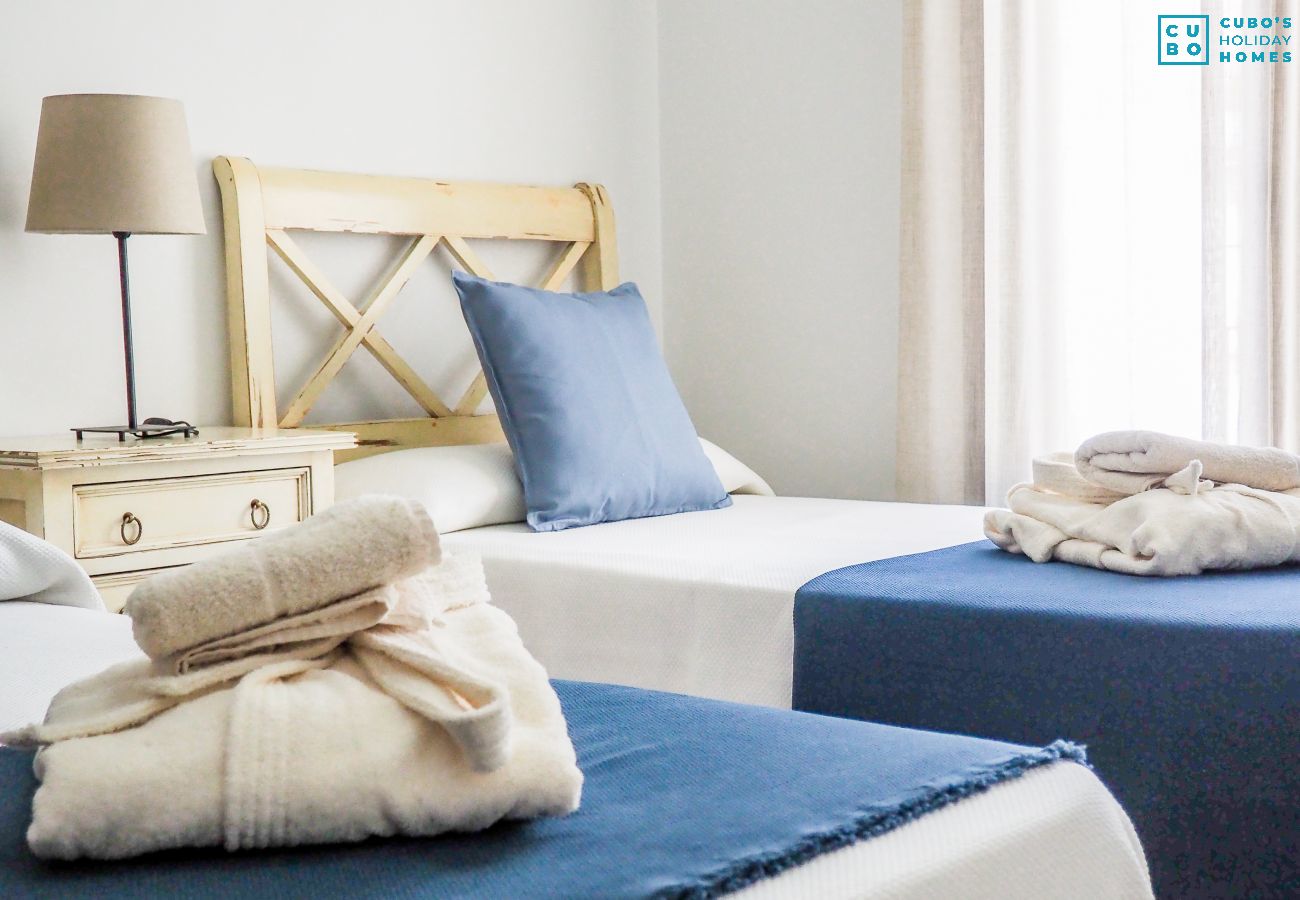 Children's bedroom of this house with fireplace in El Torcal