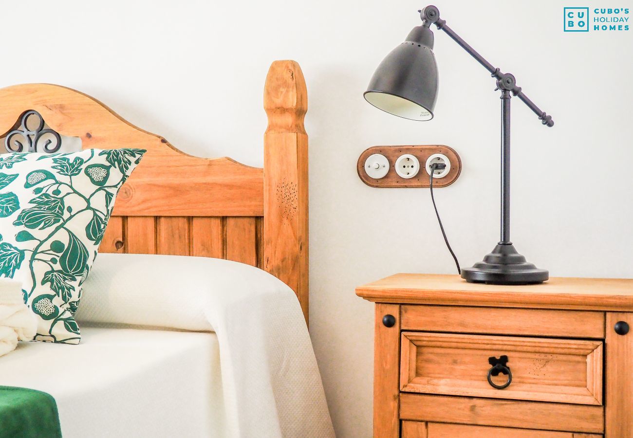 Bedroom of this house with fireplace in El Torcal