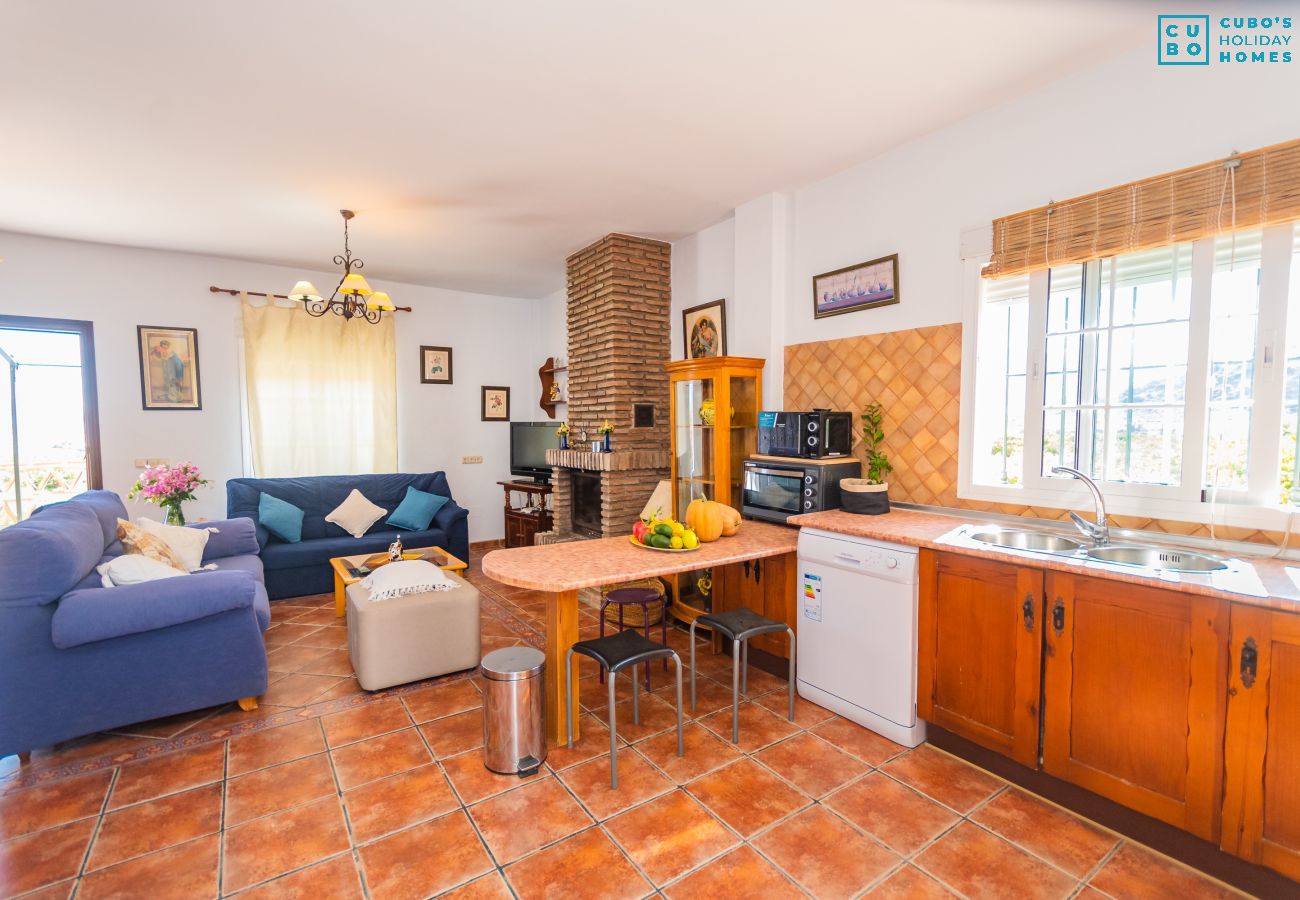 Kitchen of this house with fireplace in Coín