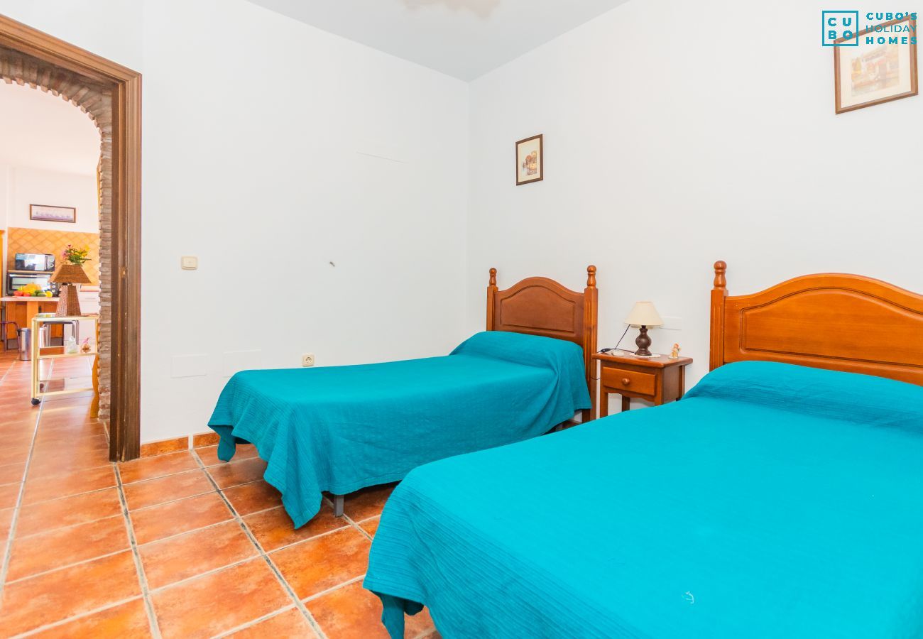 Bedroom of this house with fireplace in Coín